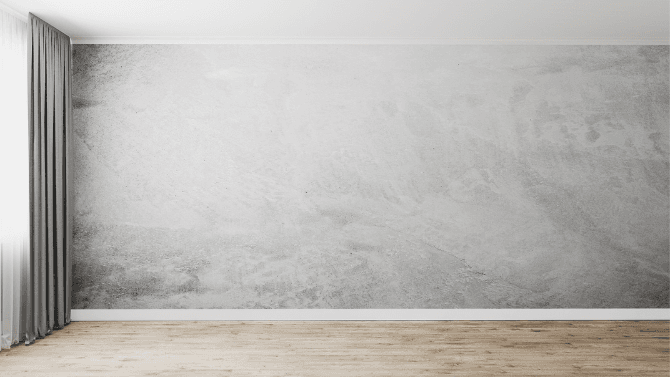 Peinture à la chaux grise sur un mur vierge 