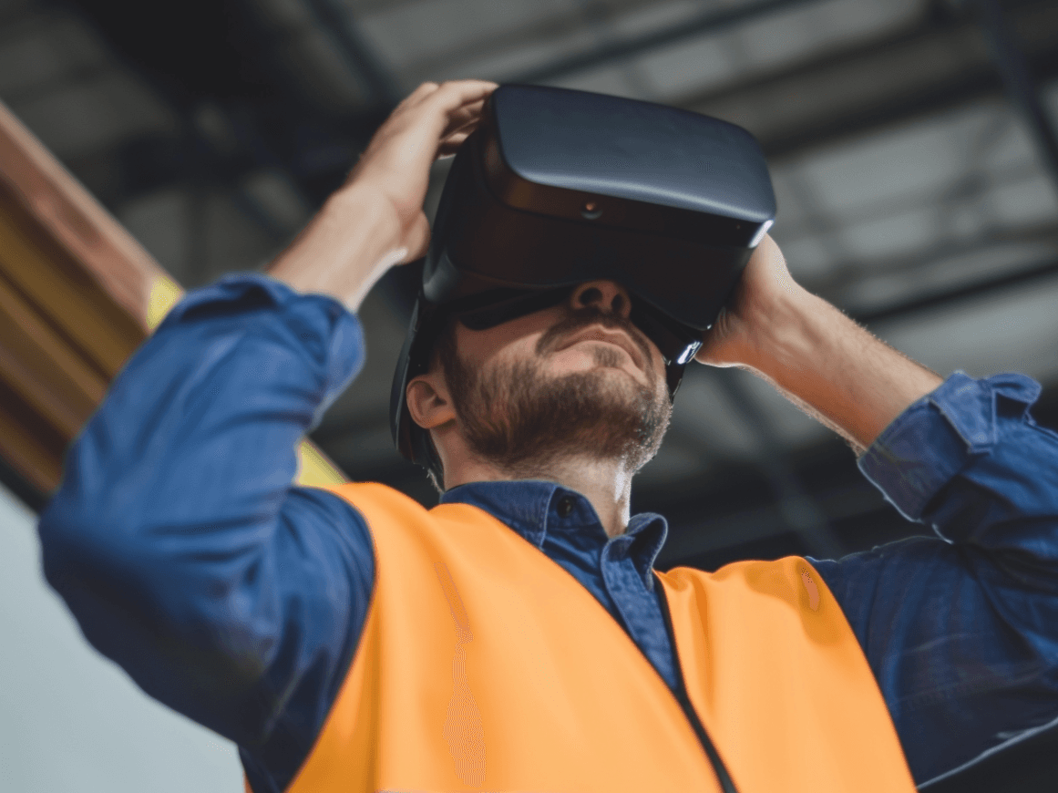 Ingénieur en construction utilisant un casque de réalité virtuelle pour la modélisation de projet.
