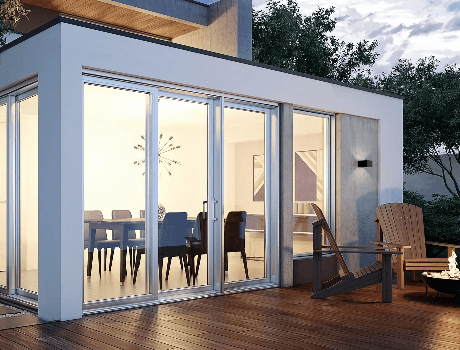 Extension résidentielle moderne avec grandes portes et fenêtres vitrées, façade blanche contemporaine, terrasse en bois, fauteuils Adirondack et espace repas lumineux.